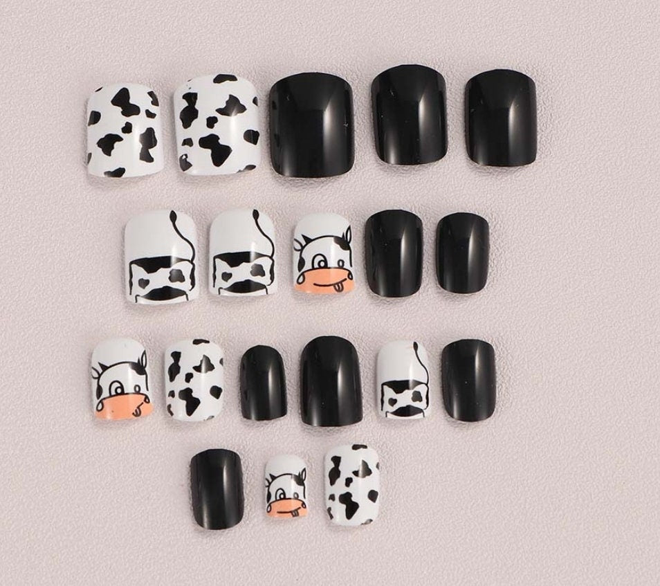 24-piece short press-on nails with black and white cow print in square cartoon kawaii design surethings