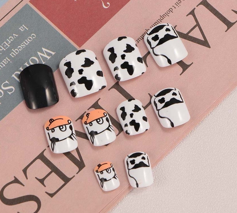 24-piece short press-on nails with black and white cow print in square cartoon kawaii design surethings