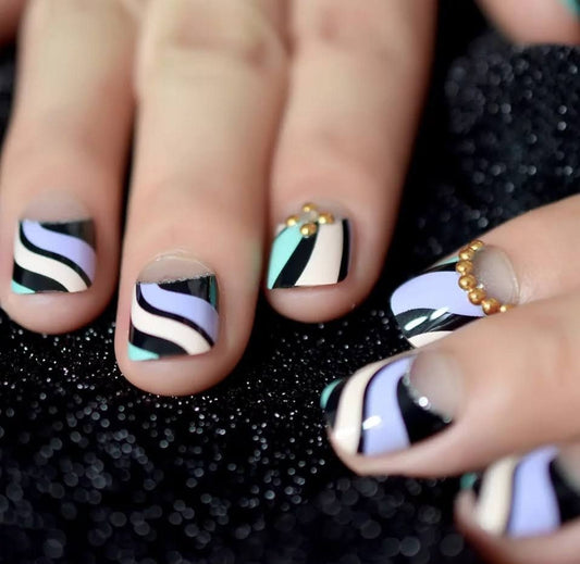 Kids size short press on nails with pink swirl and stripe design – 24 cute kawaii glue-on manicure pieces  surethings