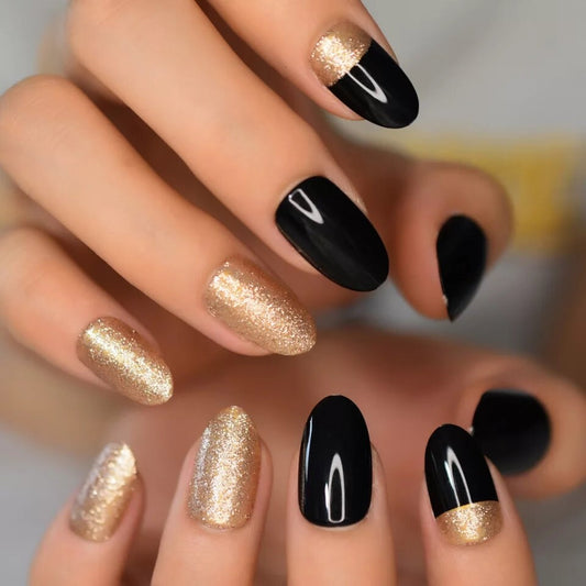 24 short almond press on nails in black with champagne gold glitter, elegant glue-on kit surethings