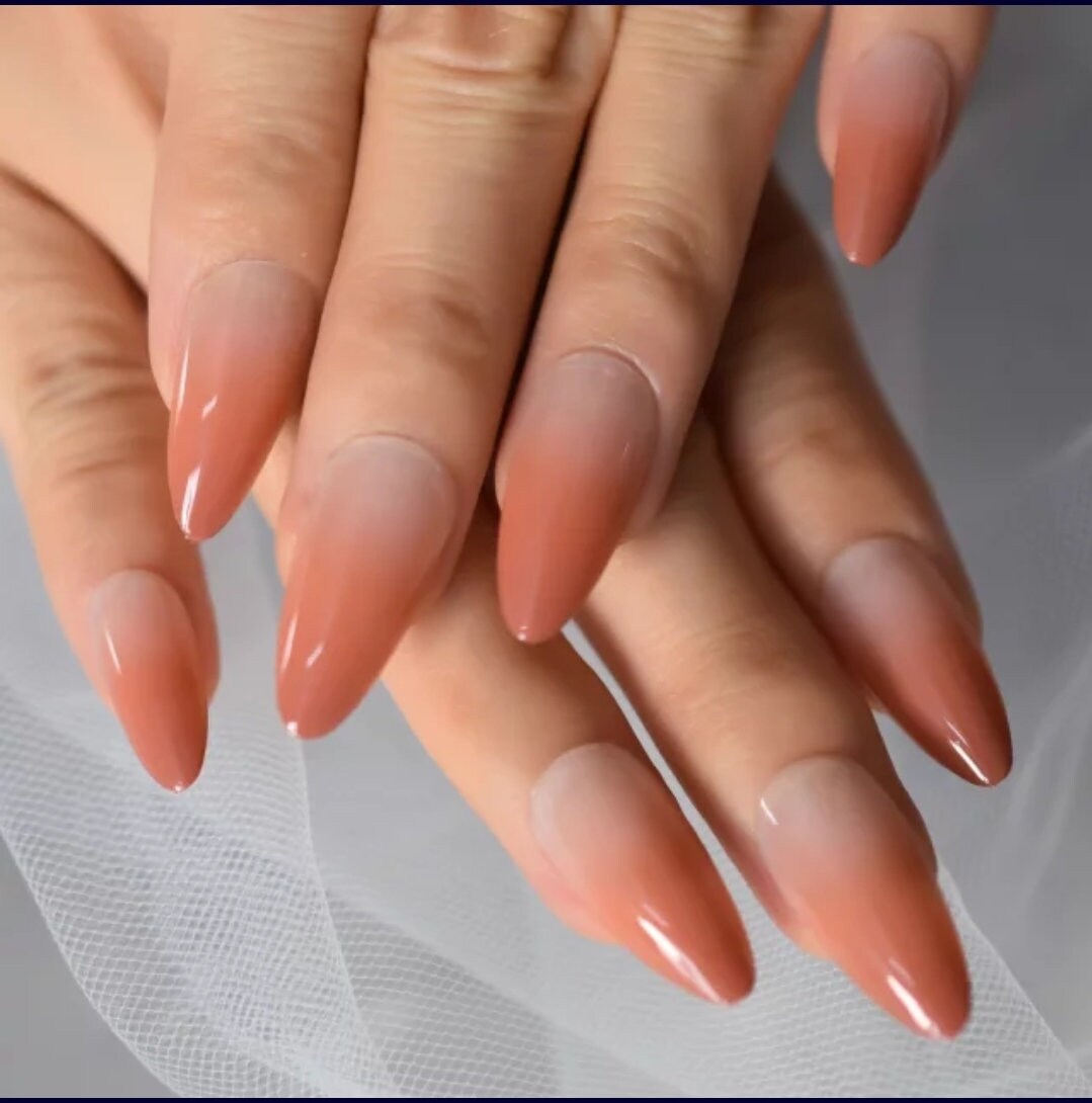 24-piece Omber long press-on nails with burnt peach ombre, nude French tips in almond and stiletto shape – fall/winter nail kit surethings