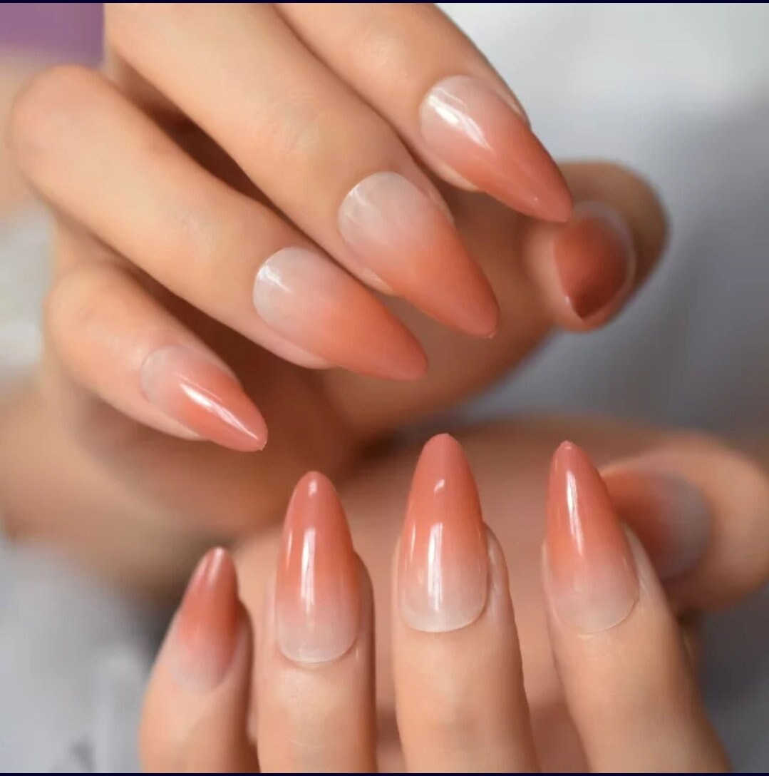 24-piece Omber long press-on nails with burnt peach ombre, nude French tips in almond and stiletto shape – fall/winter nail kit surethings