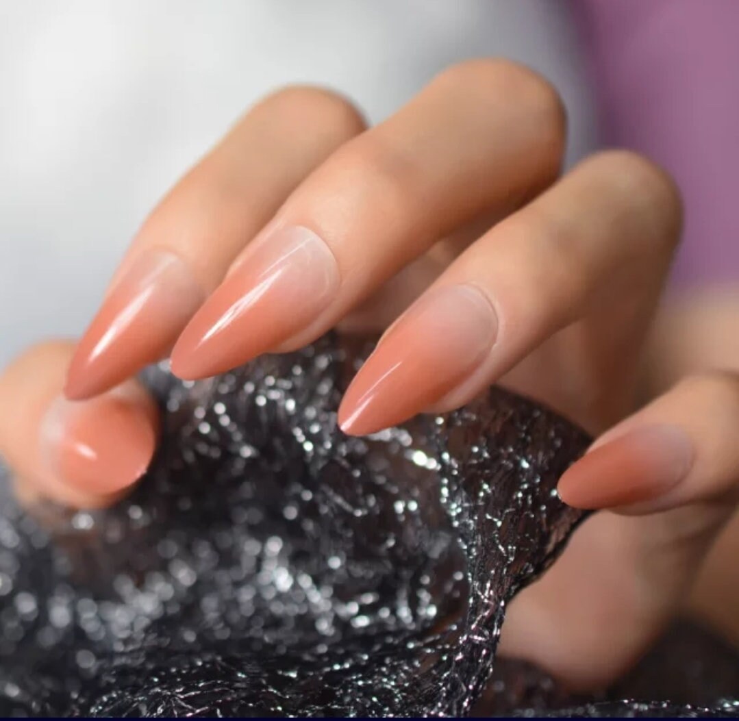 24-piece Omber long press-on nails with burnt peach ombre, nude French tips in almond and stiletto shape – fall/winter nail kit surethings