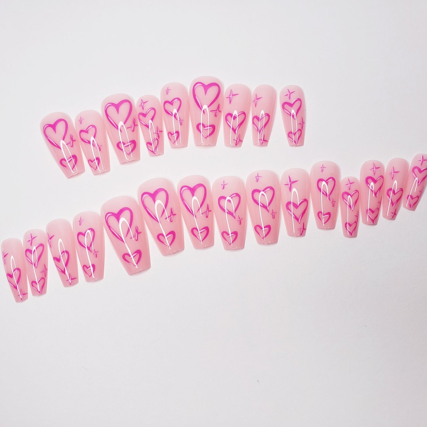 24 pink long press-on nails in coffin shape with cute Valentine heart design, bright kawaii romantic glue-on nail set surethings
