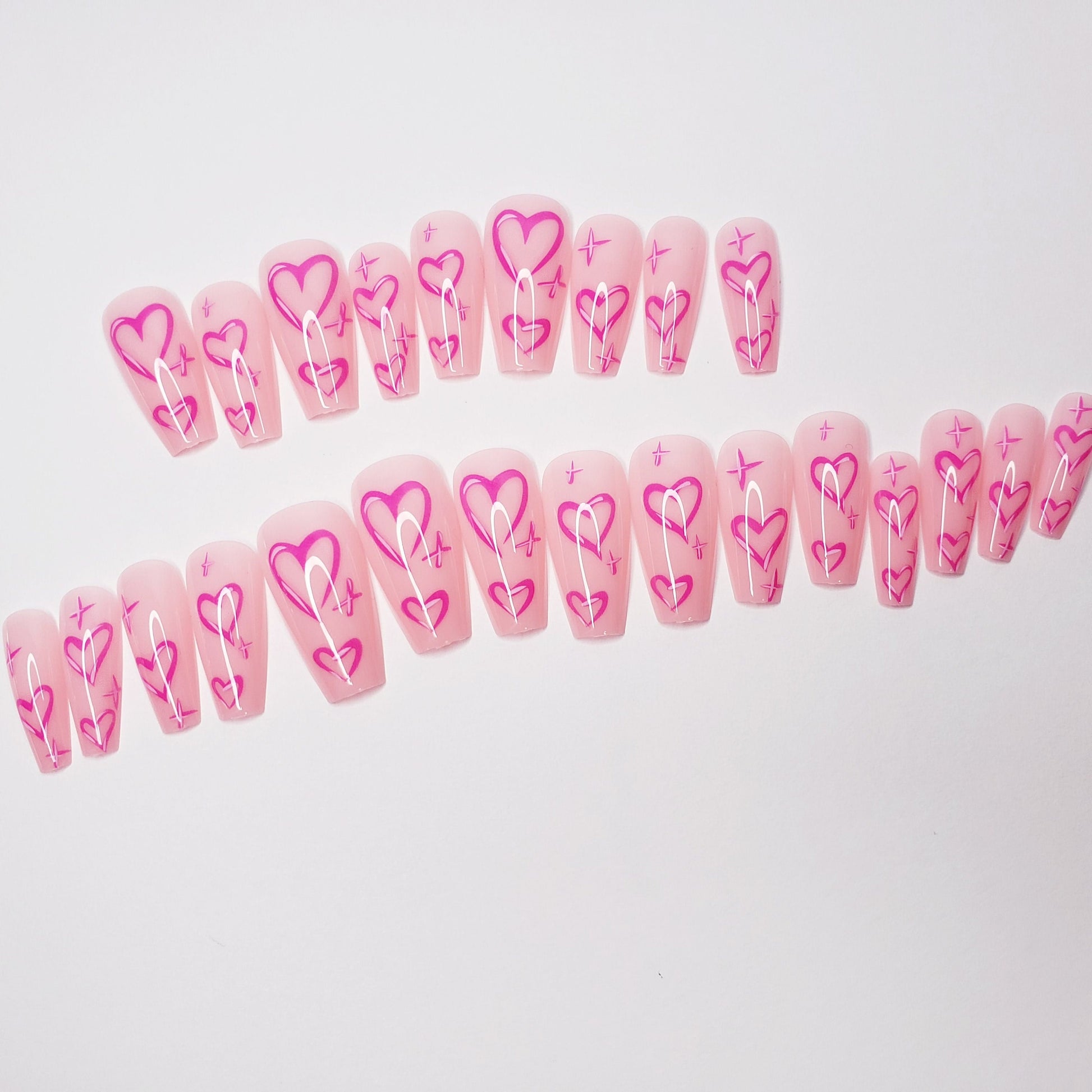 24 pink long press-on nails in coffin shape with cute Valentine heart design, bright kawaii romantic glue-on nail set surethings