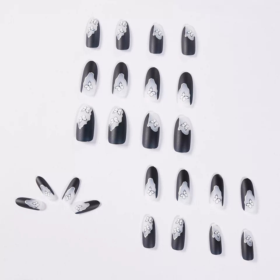 24 long press-on nails with matte black and white ombre butterfly design, gothic style with almond and round shapes, metallic line accents surethings