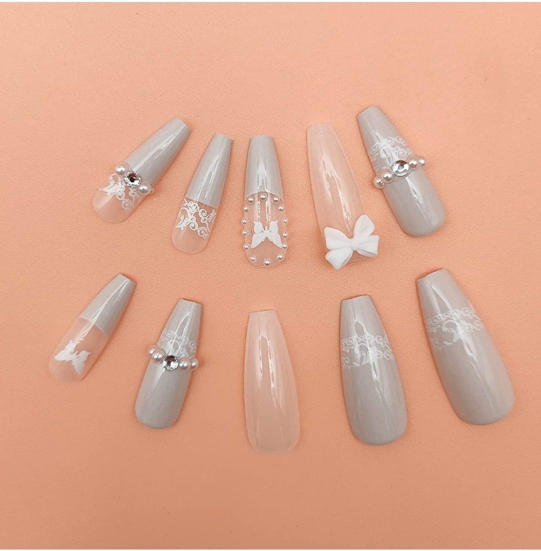 24 off-white wedding long press-on nails in coffin shape with bow, lace, and gem details – elegant glue-on nail set surethings