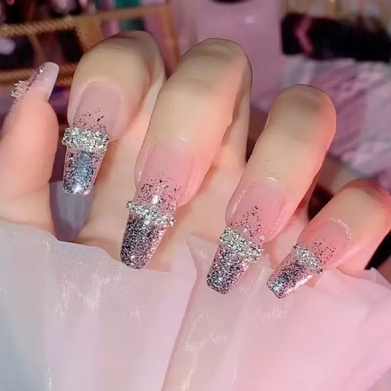 24-piece extra long press on nails in glitter ombre French style with silver and purple rhinestones and gem accents surethings