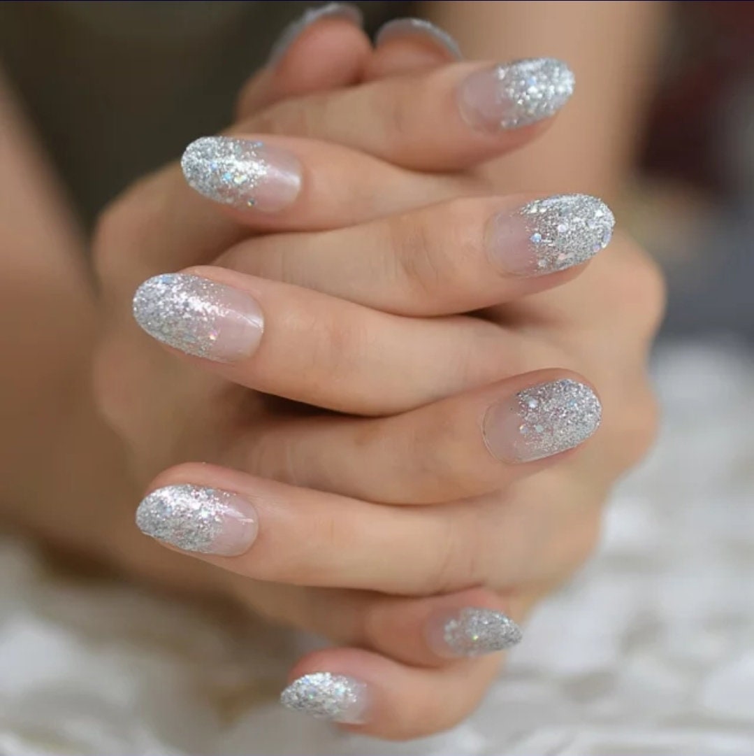 24-piece medium almond press-on nails with clear glass slipper design, glitter, and holographic ombre effect surethings