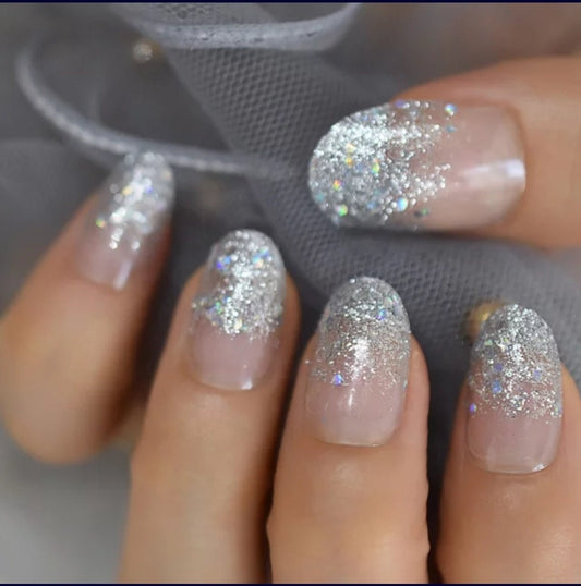 24-piece medium almond press-on nails with clear glass slipper design, glitter, and holographic ombre effect surethings