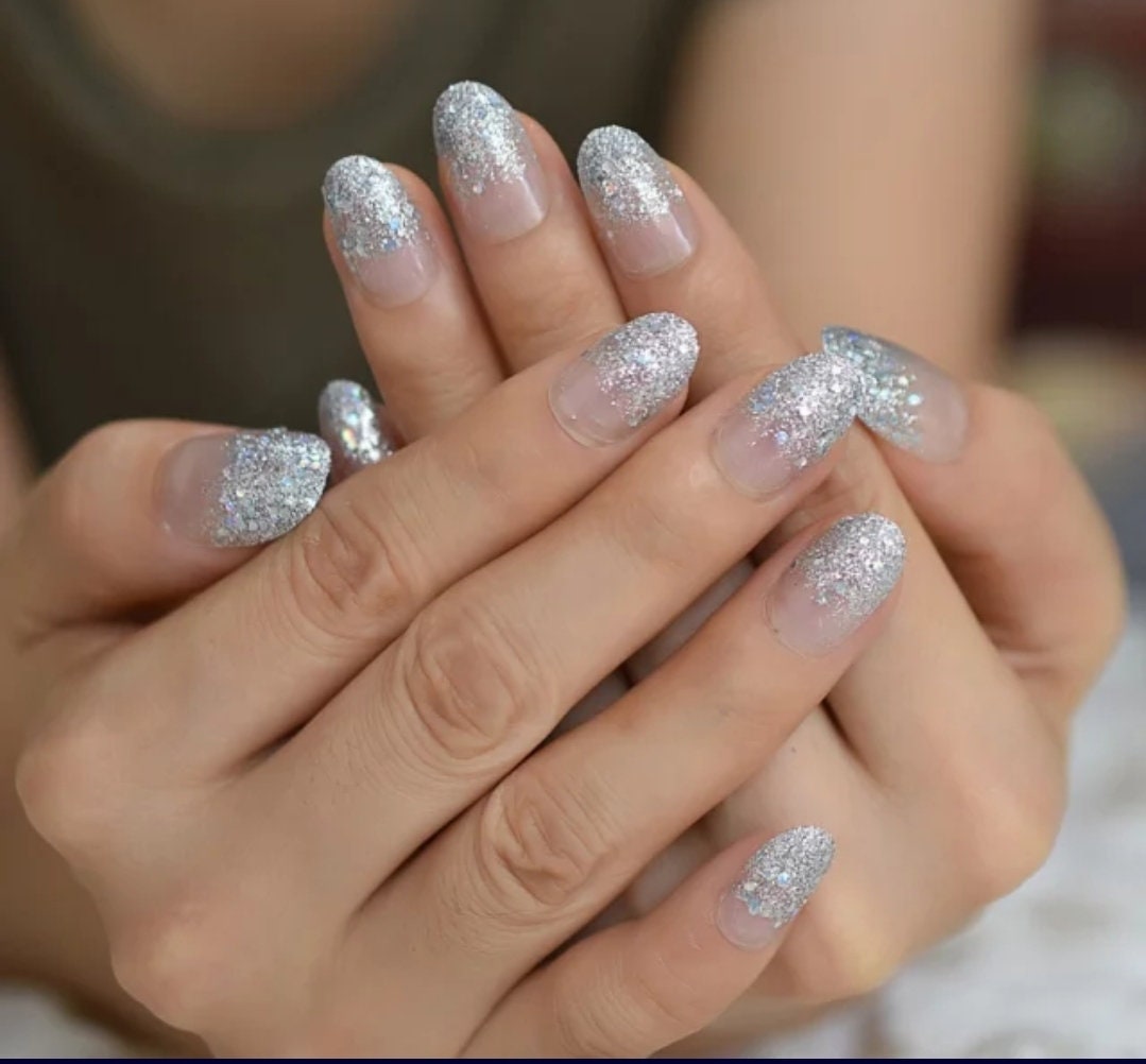 24-piece medium almond press-on nails with clear glass slipper design, glitter, and holographic ombre effect surethings