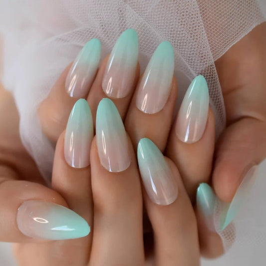 Mint green press-on nails displayed on almond-shaped nails with a glossy finish and elegant seasonal styling-surethings