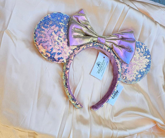 Close-up of Holographic Pink Gold Sequin Minnie Ears Disney Parks headband with iridescent Mickey Mouse Pink bow and shimmering sequins surethings